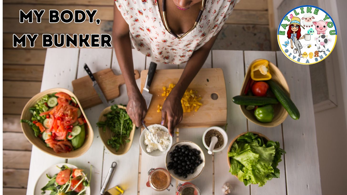 A woman stands at table chopping cauliflower, surrounded in other vegetables, the post title "My Body, My Bunker"