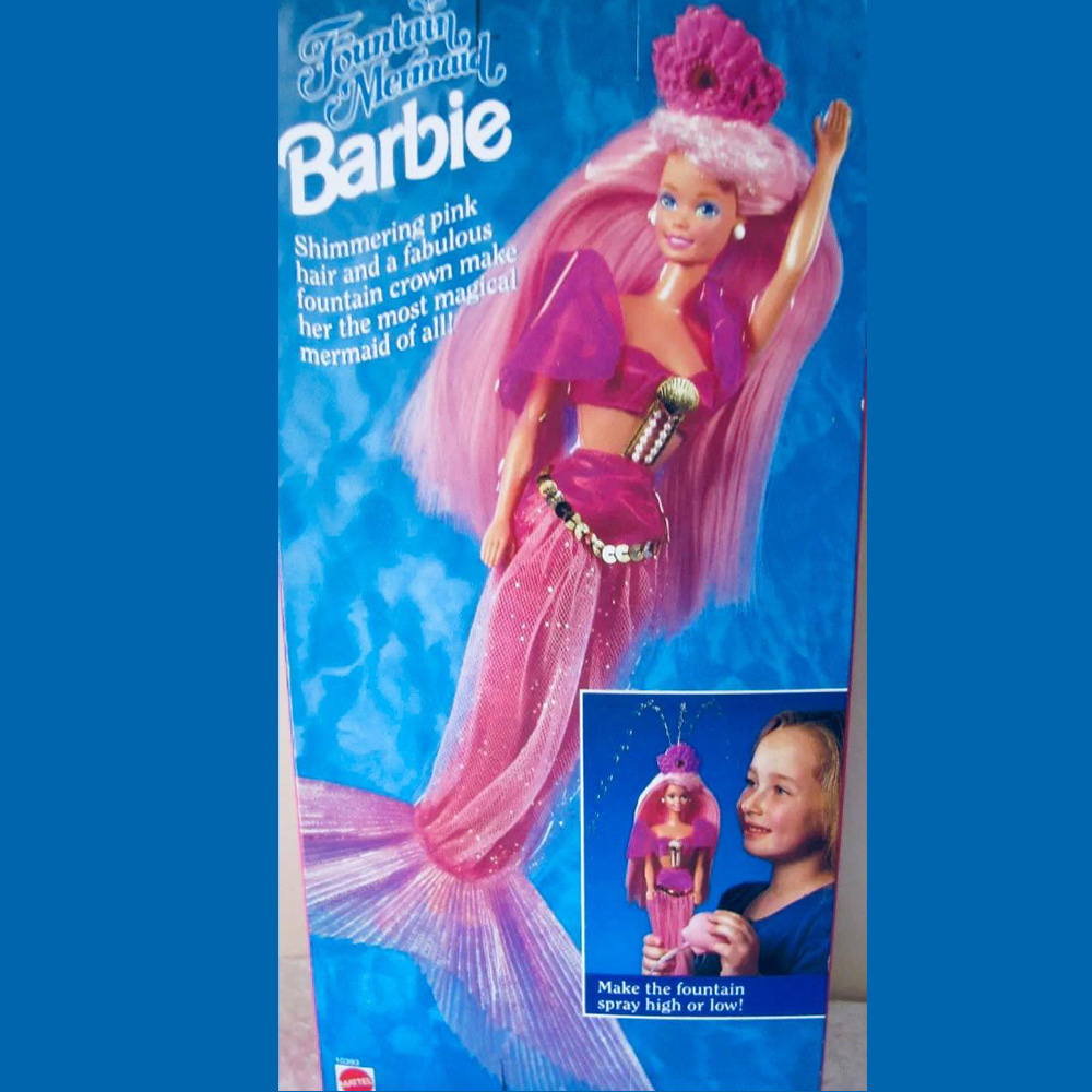 Fountain Mermaid Barbie as pictured on the back of her original box with pink hair coral crown and pink bikini with a tail. 