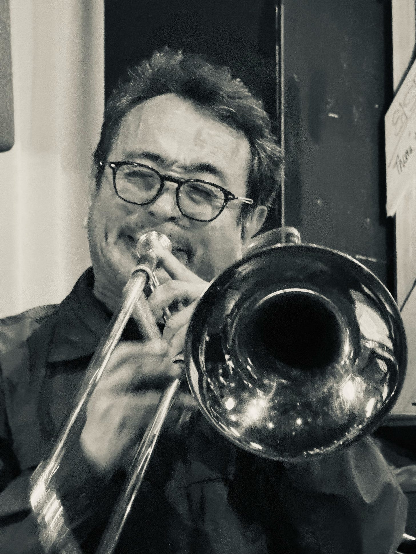 A person playing a trombone

AI-generated content may be incorrect.