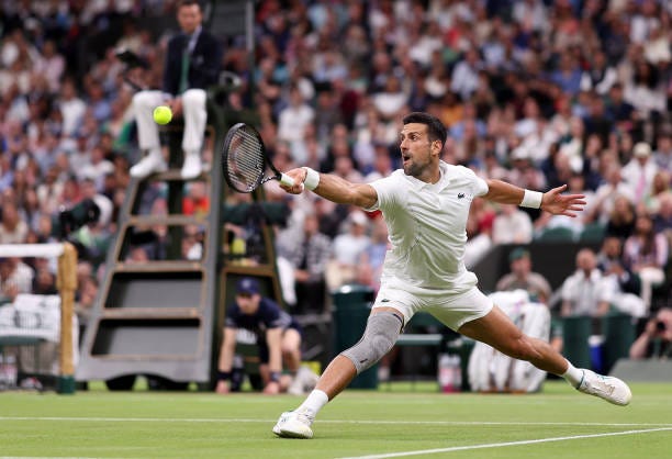 Novak Djokovic of Serbia plays a backhand against Holger Rune of Denmark in his Gentlemen's Singles fourth round match during day eight of The... Novak Djokovic of Serbia plays a backhand against Holger Rune of Denmark in his Gentlemen's Singles fourth round match during day eight of The...