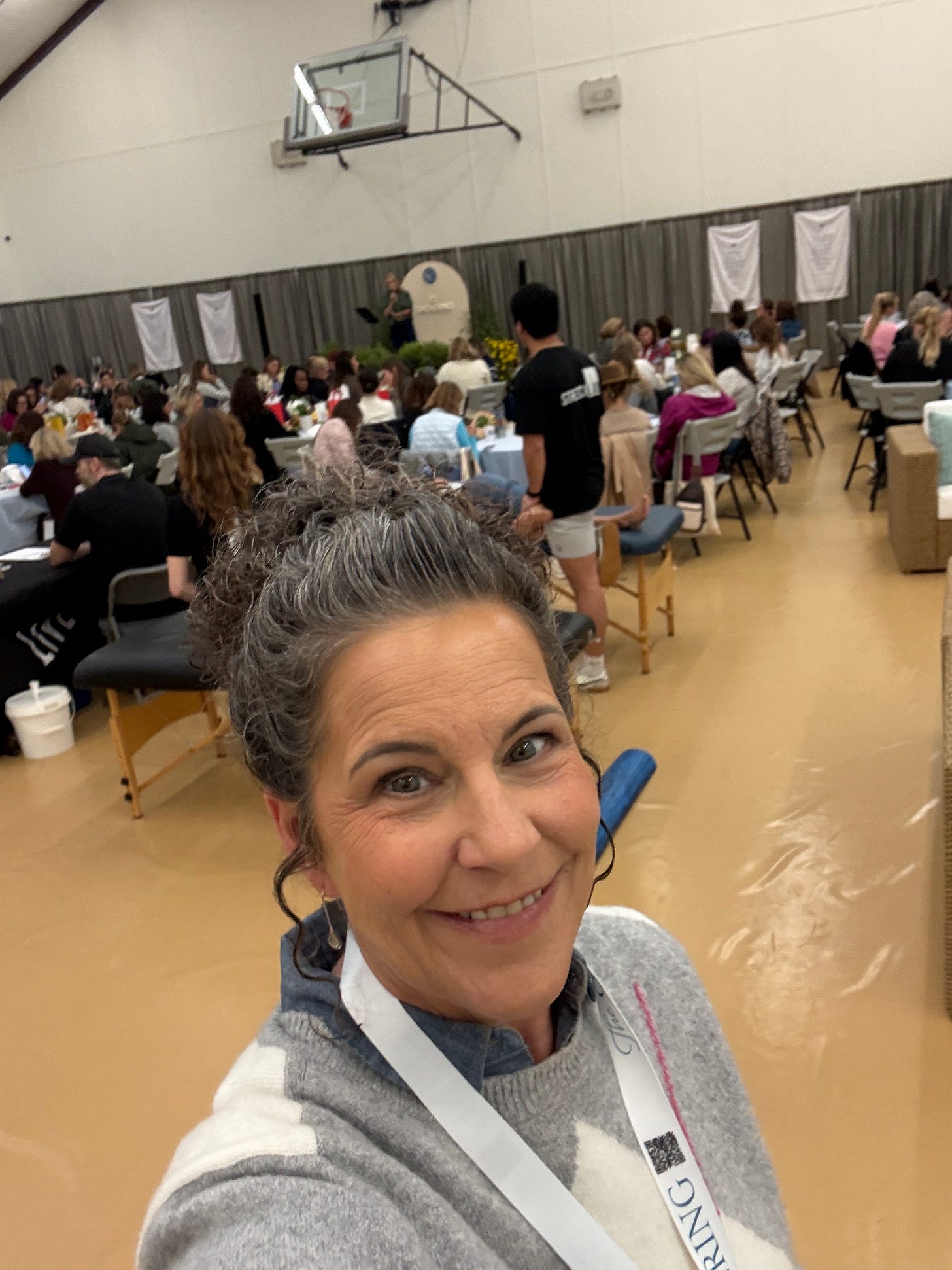 Valerie Cantella in a room full of women.