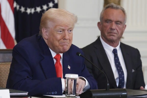 President Donald Trump, left, speaks as Health and Human Services Secretary Robert F. Kennedy Jr. listens during a Make America Healthy Again (MAHA) Commission Event in the East Room of the White House, Thursday, May 22, 2025, in Washington. (AP Photo/Jacquelyn Martin)