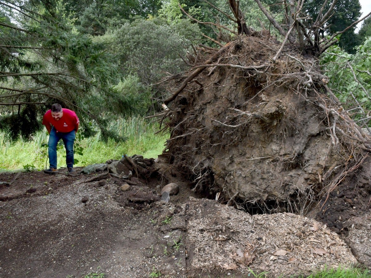 Rhode Island tornado lifts car as New England storms damages homes, flood roads