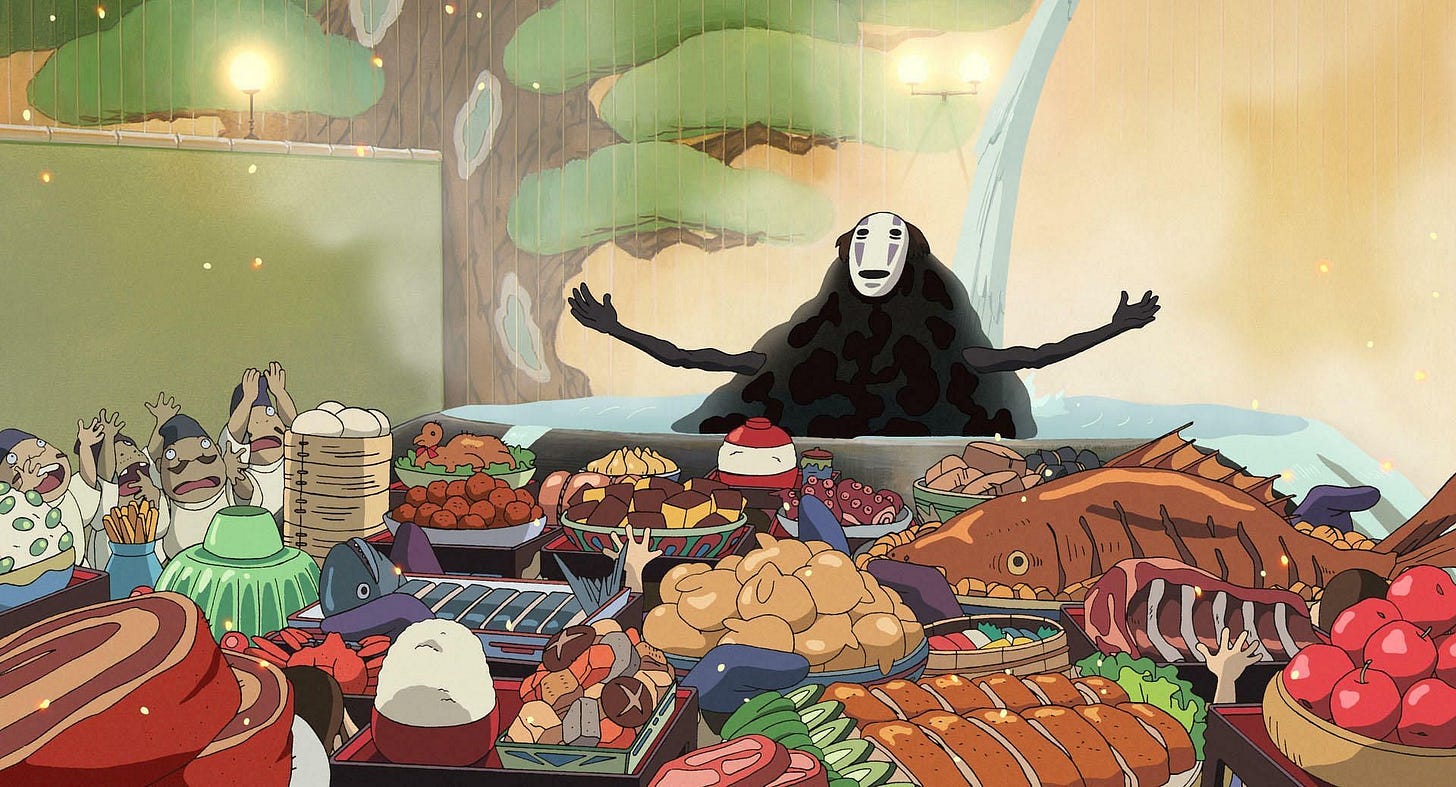 Screenshot from Spirit Away with the dark spirit being presnted with a feast