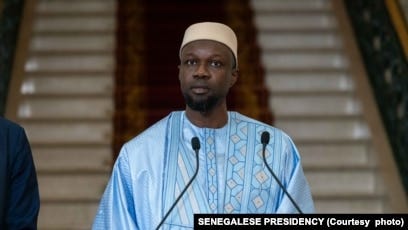 This handout picture taken an distributed by the Senegalese Presidency on April 5, 2024 shows Senegalese Prime Minister Ousmane Sonko addressing the press ahead of the announcement of the list of the ministers at the Presidential Palace in Dakar. This handout picture taken an distributed by the Senegalese Presidency on April 5, 2024 shows Senegalese Prime Minister Ousmane Sonko addressing the press ahead of the announcement of the list of the ministers at the Presidential Palace in Dakar.