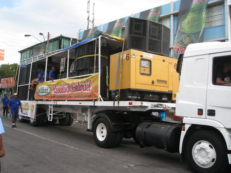 Large truck with speakers all around.