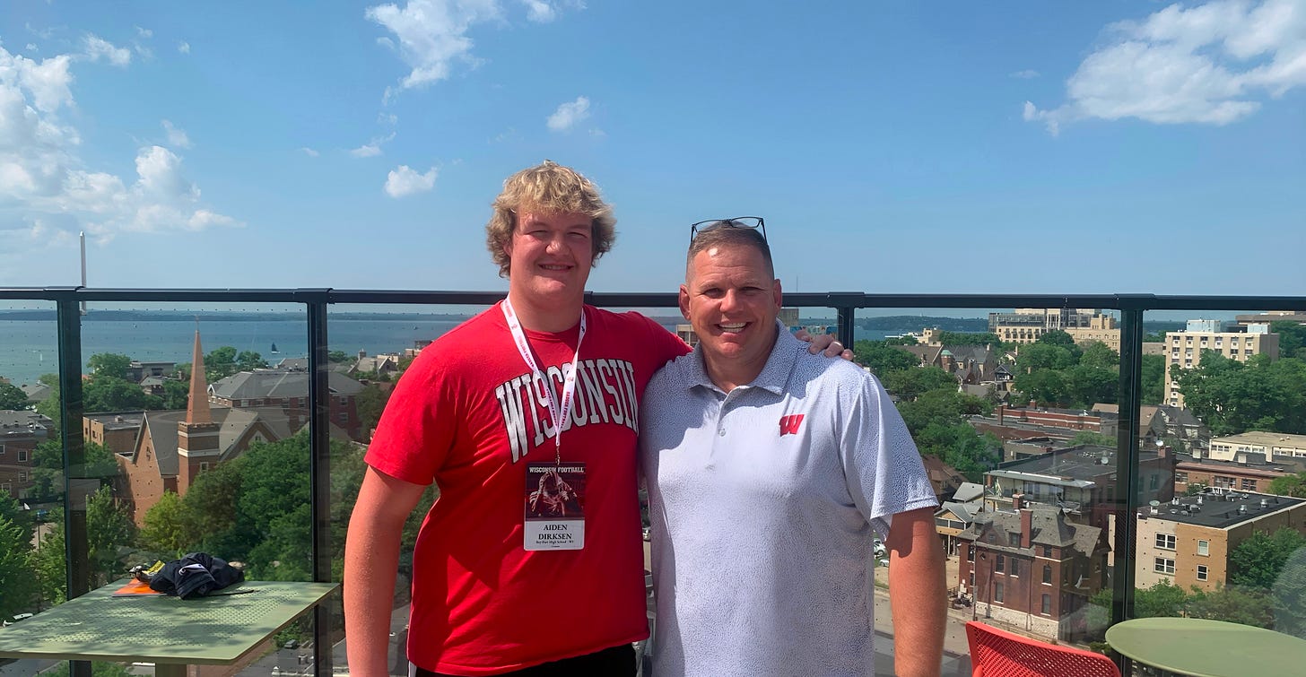 Wisconsin Badgers preferred walk-on Aiden Dirksen standing next to position coach AJ Blazek 