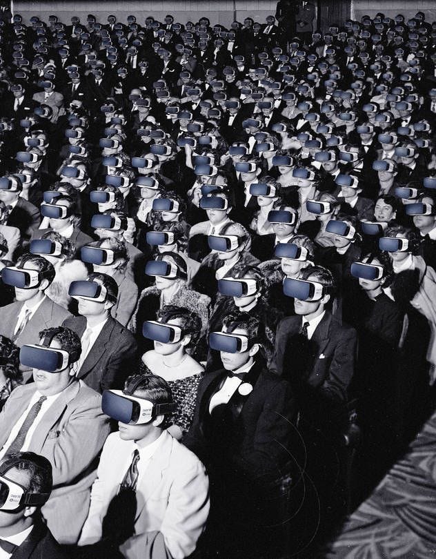This may contain: a large group of people in suits and ties are wearing virtual headsets while sitting down