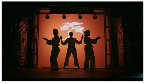 Johnny breaking blocks, Miyagi-do on stage, Miguel vs Axel