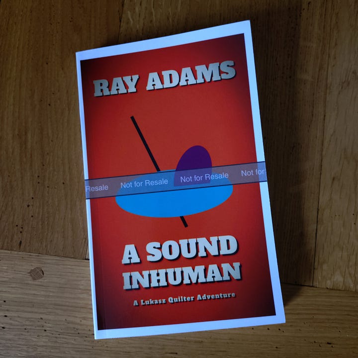 On the left, a promotional image of the book, featuring the cover over a starry background, with the words "A planet untouched, a horror unknown, a sound inhuman", and on the right, a proof copy on my dining room table