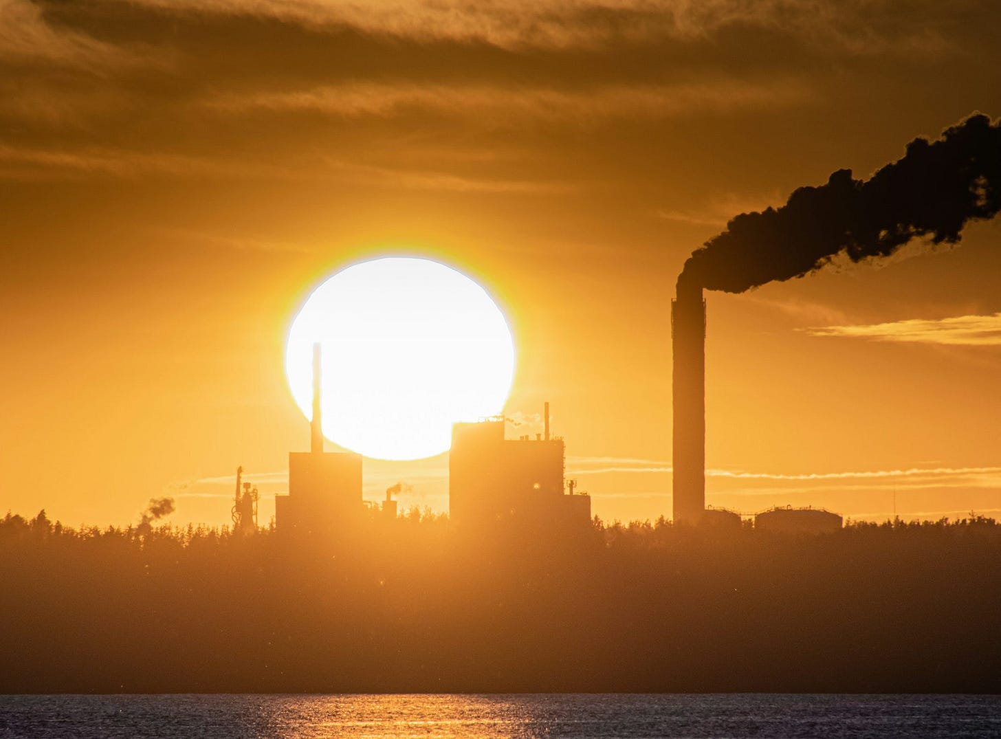 white concrete building near body of water during daytime