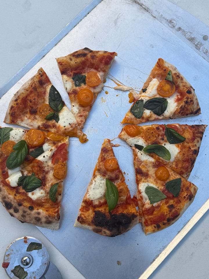 pizzas in backyard with ooni