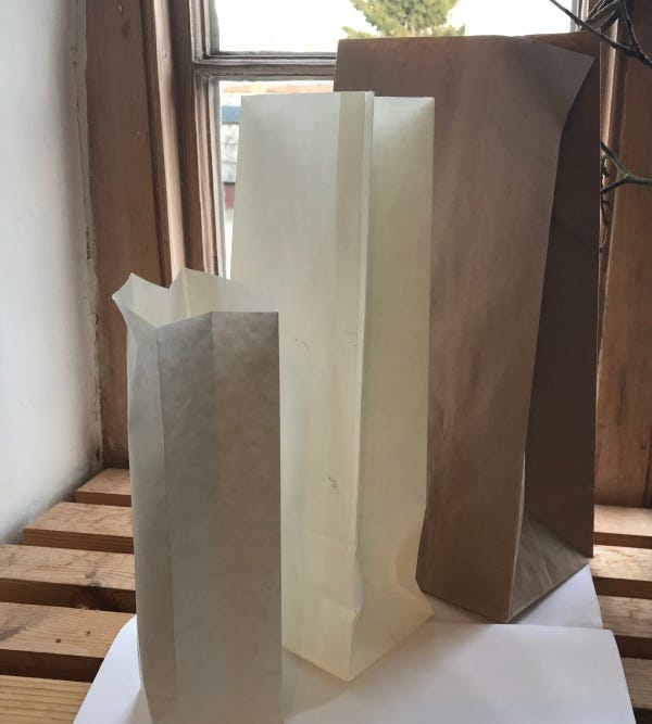 Brown and white paper bags with bolck bottoms