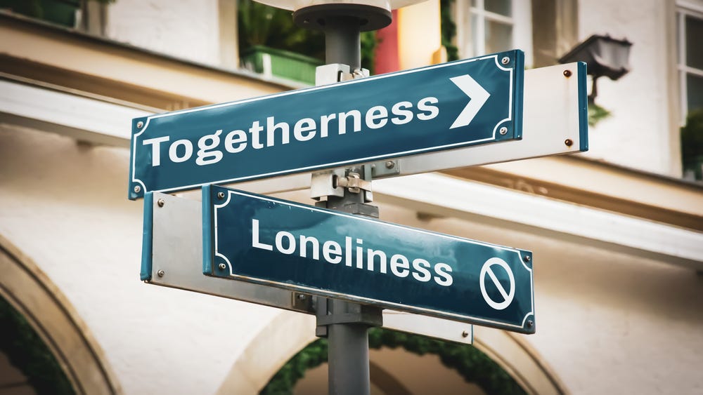 Choosing the path of togetherness following a sign saying togetherness Choosing the path of togetherness following a sign saying togetherness