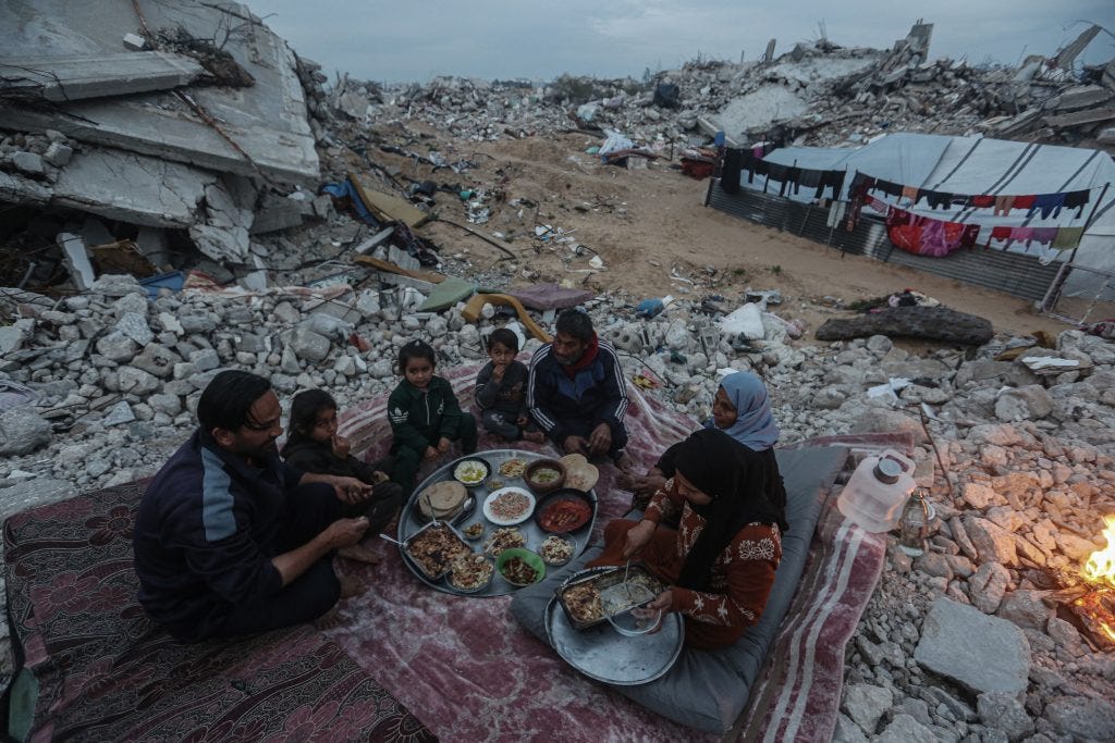 Palestinian Karam Abu Haloub and his wife Faten prepare iftar food during the third day of the holy month of Ramadan in a tent they set up on the ruins of their destroyed home in the Al-Shimaa area of Beit Lahia in the northern Gaza Strip, March 3, 2025. Thousands of Palestinian families in the Gaza Strip live in tents amidst a lack of basic necessities after the Israeli war on the Gaza Strip. (Photo by Omar Ashtawy/ apaimages) Palestinian Karam Abu Haloub and his wife Faten prepare iftar food during the third day of the holy month of Ramadan in a tent they set up on the ruins of their destroyed home in the Al-Shimaa area of Beit Lahia in the northern Gaza Strip, March 3, 2025. Thousands of Palestinian families in the Gaza Strip live in tents amidst a lack of basic necessities after the Israeli war on the Gaza Strip. (Photo by Omar Ashtawy/ apaimages)