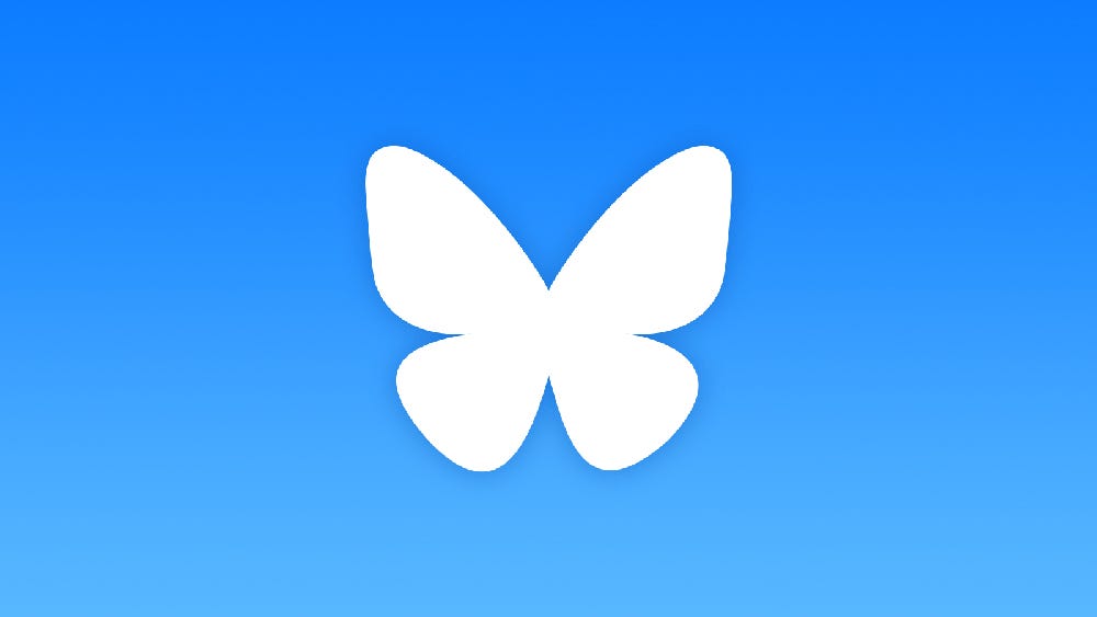 The white Bluesky logo on a blue gradient background