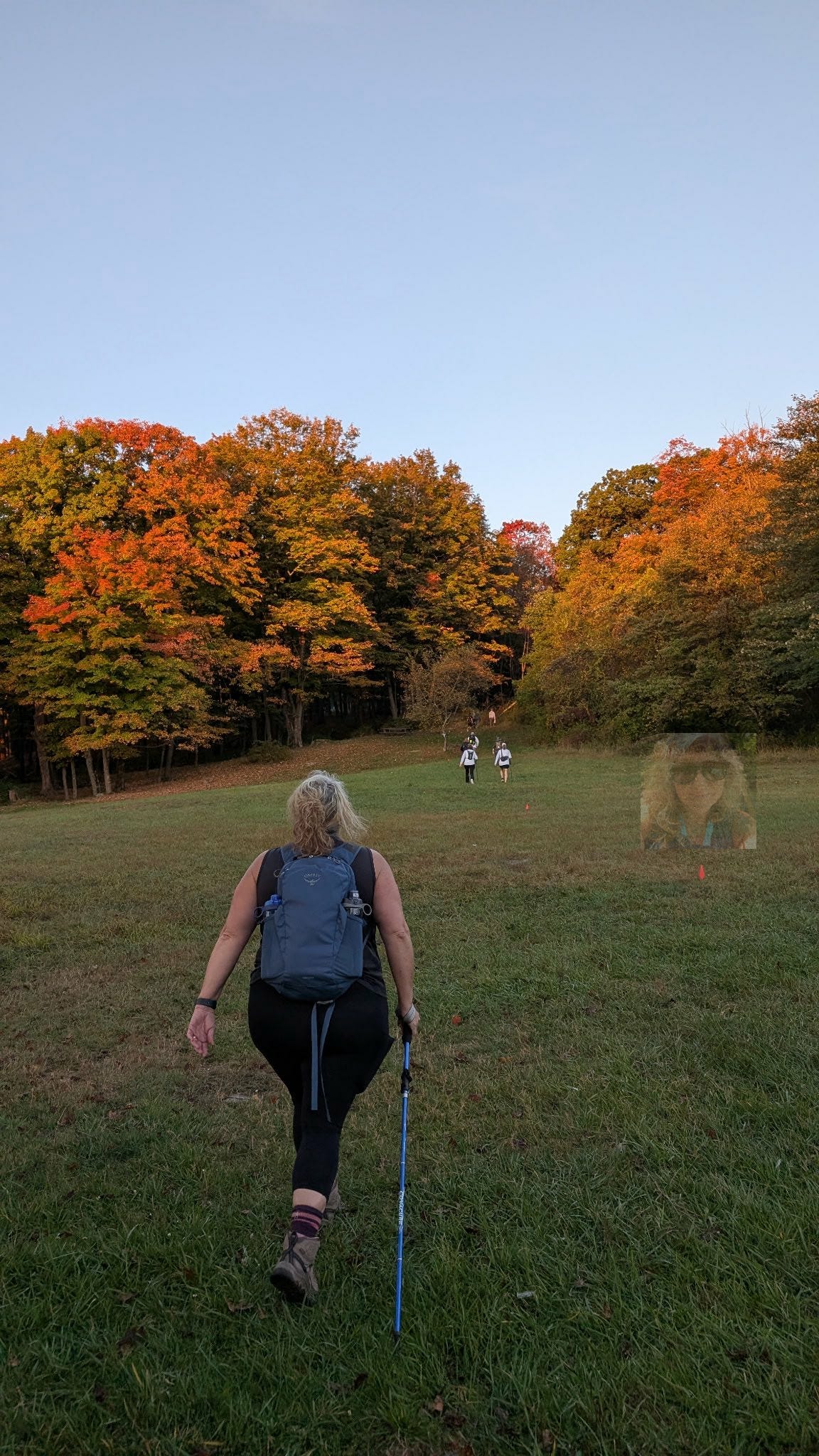 May be an image of 2 people, nature and grass