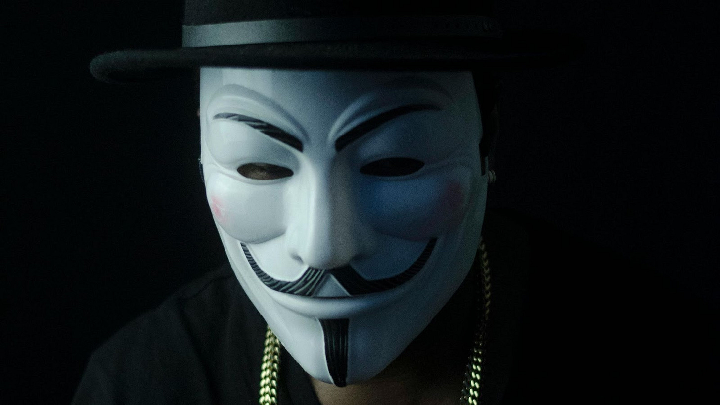 Person in Guy Fawkes mask Person in Guy Fawkes mask