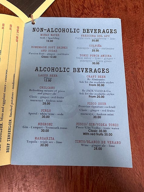 The pages of Awicha's menu including appetizers, duck dishes, mains, and an extensive beverage menu.