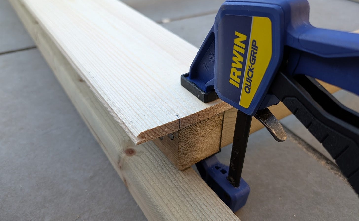 Cladding clamped in place to help with alignment of the first overhang. 