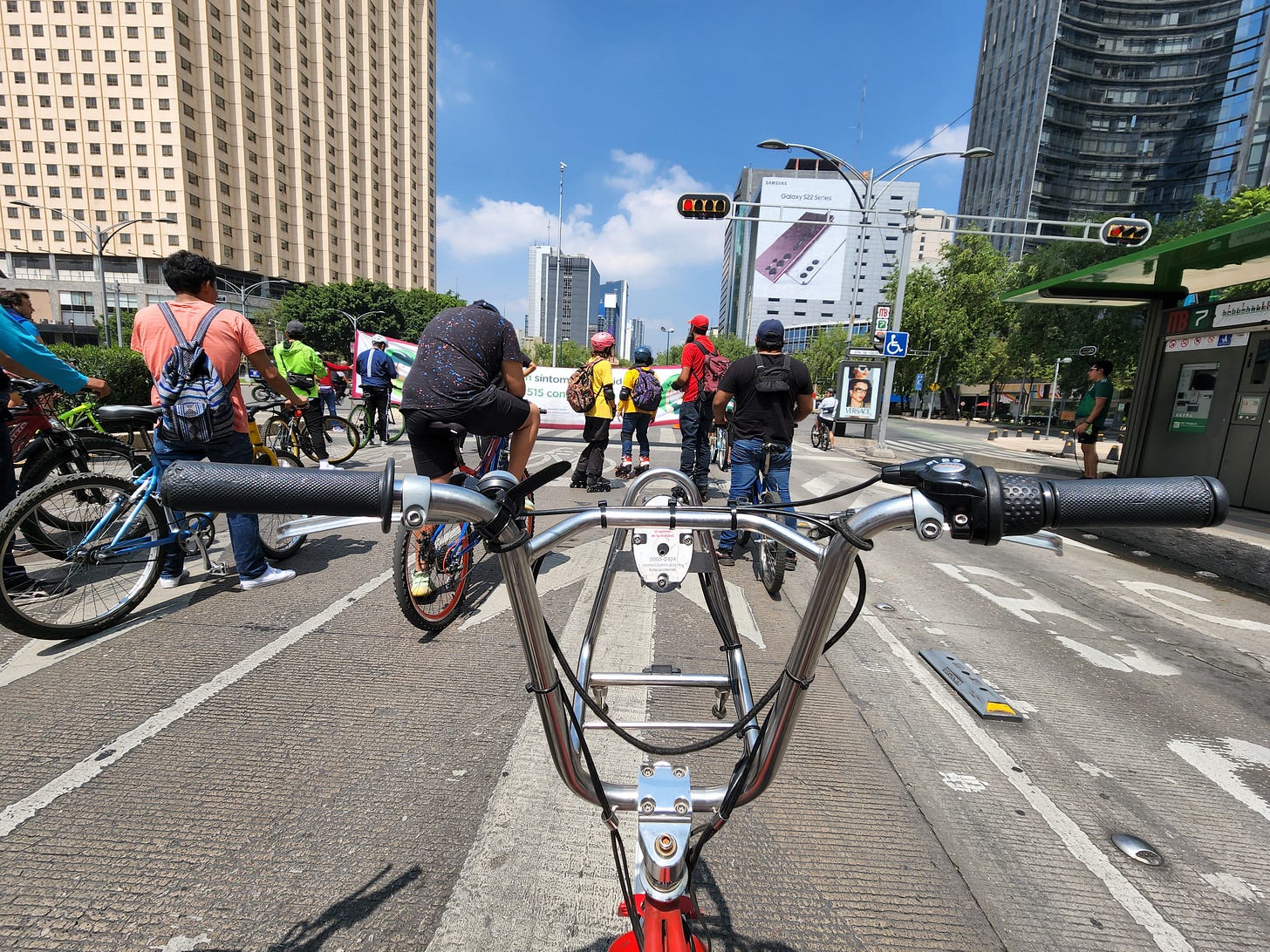 The view on Paseo de Reforma from behind bike handlebars
