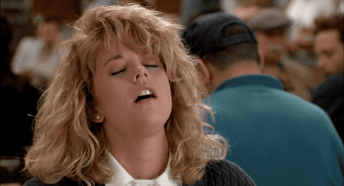 Meg Ryan in When Harry Met Sally rubbing her face erotically