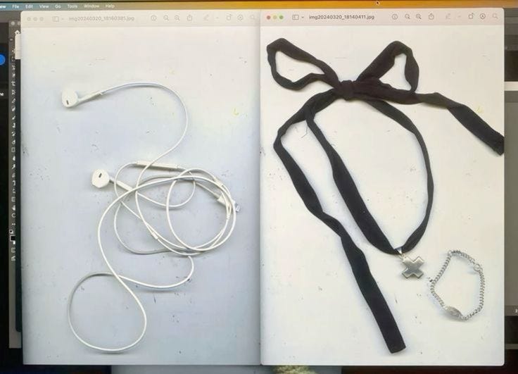 This may contain: an open book with headphones attached to the cover and in front of it is a computer screen