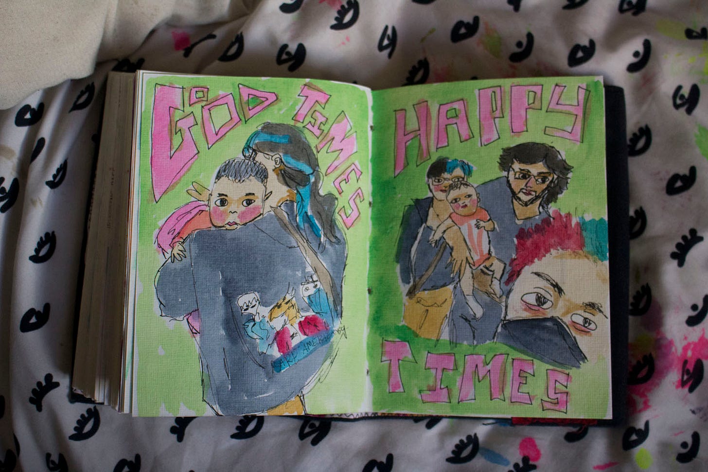 two drawings or a group of people with a baby, with the text "good times, happy times"