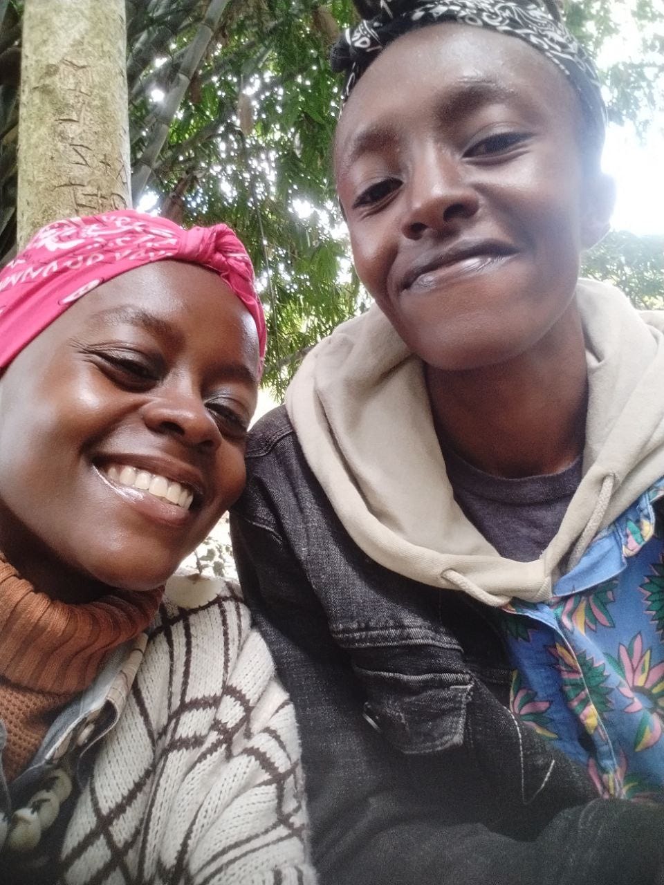 Valary Ambati and Isabell Wambui having a picnic in the park.
