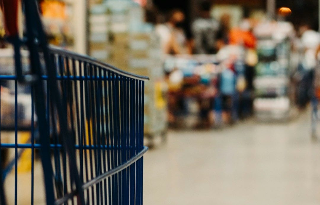 blue shopping cart on street during daytime blue shopping cart on street during daytime