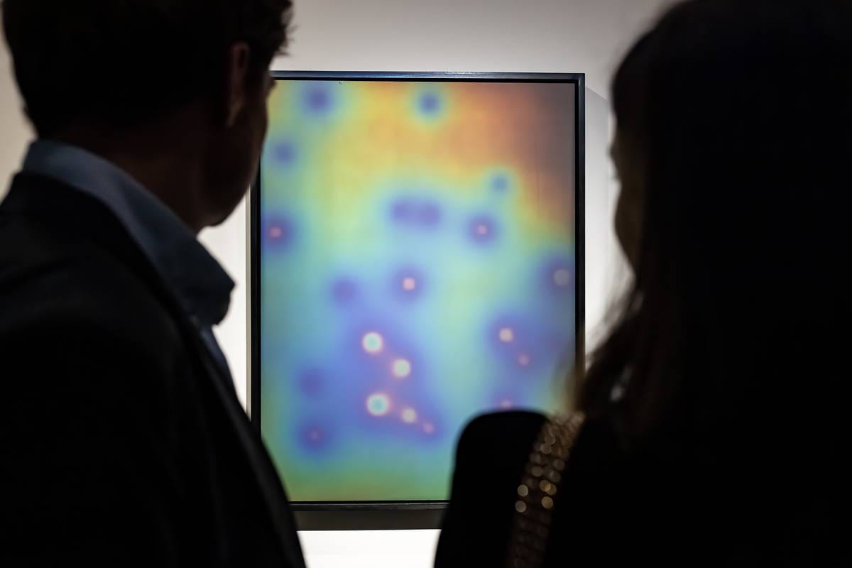 Two people view a pale painting Two people view a pale painting