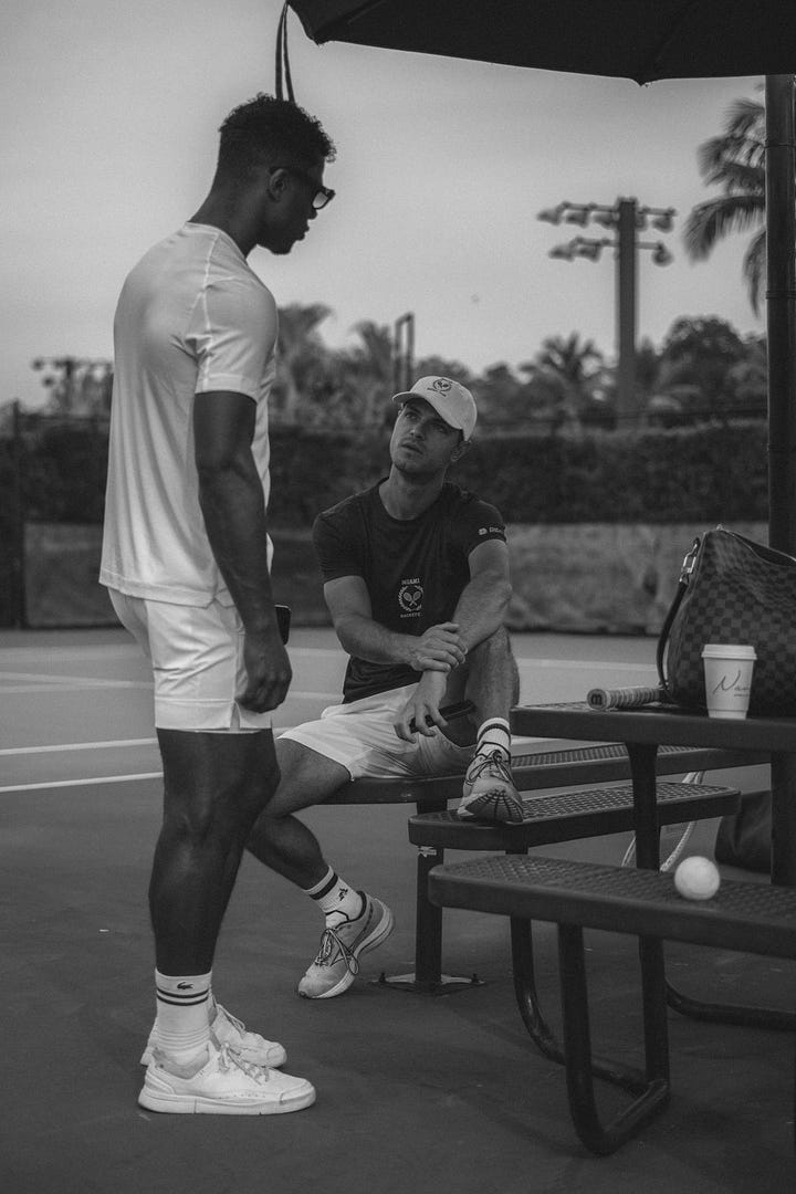 A black and white photo series of men and women playing tennis, modeling Miami Racket Club apparel, and chatting courtside. Mix of action shots, posed portraits, and candid moments, showcasing both athleticism and casual club atmosphere.