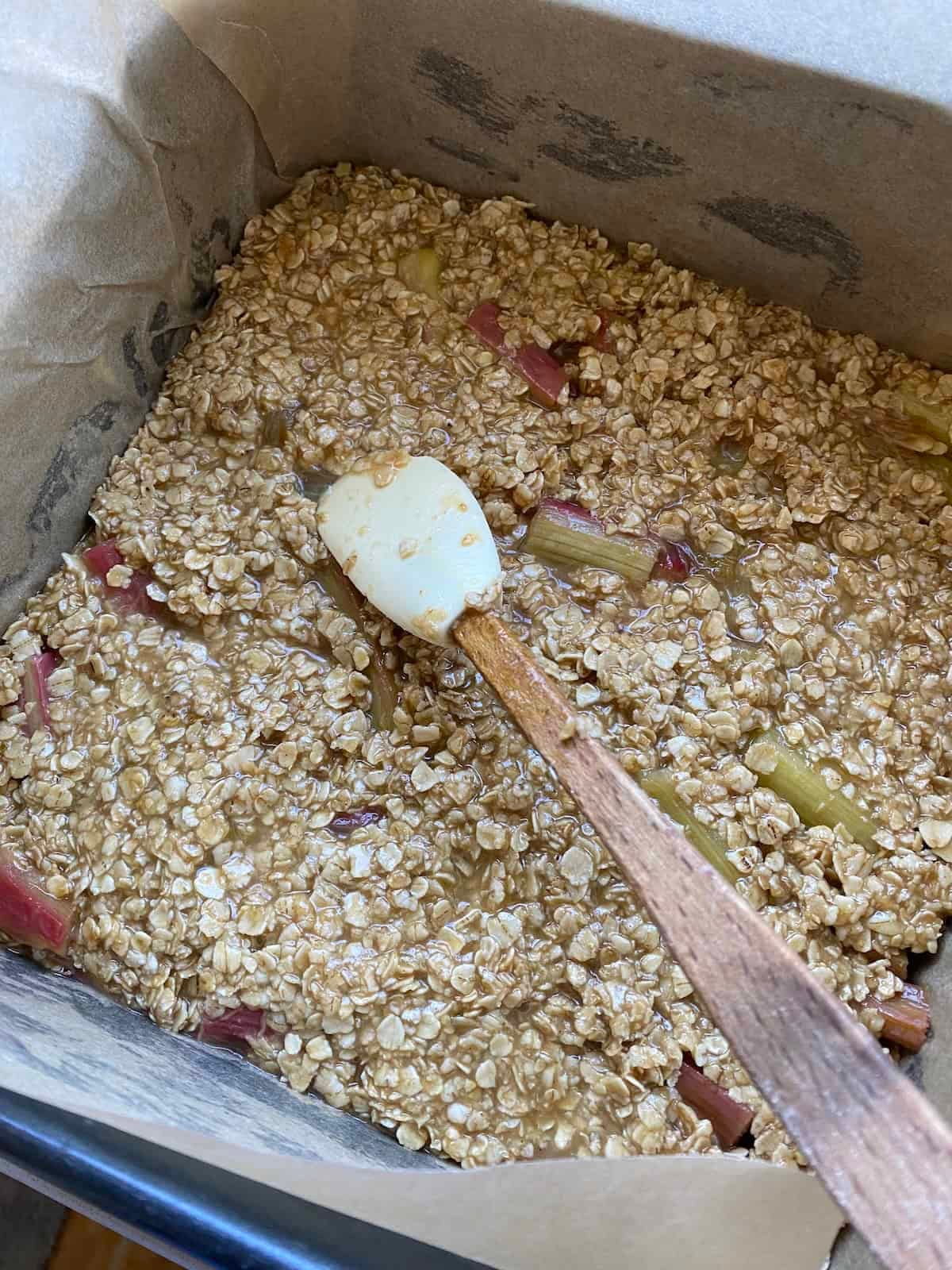 Rhubarb Flapjacks in a square tin ready for baking. Rhubarb Flapjacks in a square tin ready for baking.