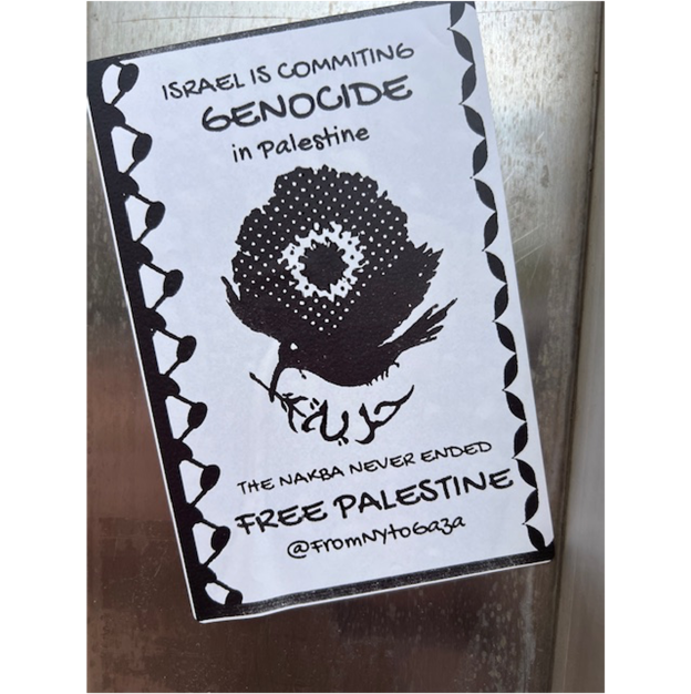A white and black sign with a bird on it

Description automatically generated