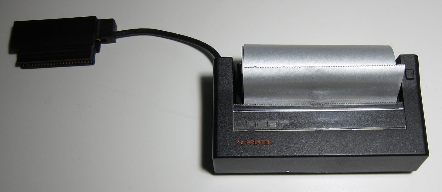 Sinclair ZX Printer fitted with a roll of silver-coloured paper. 