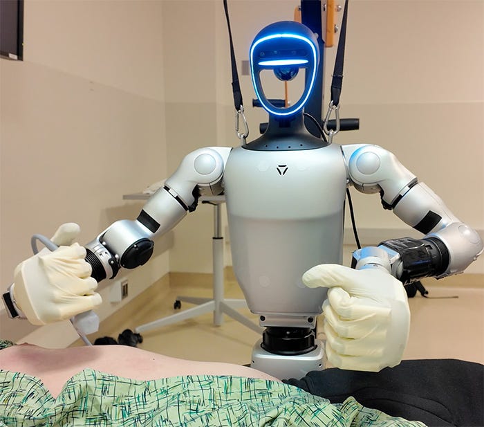 Photo of a robot holding an ultrasound probe above a patient 