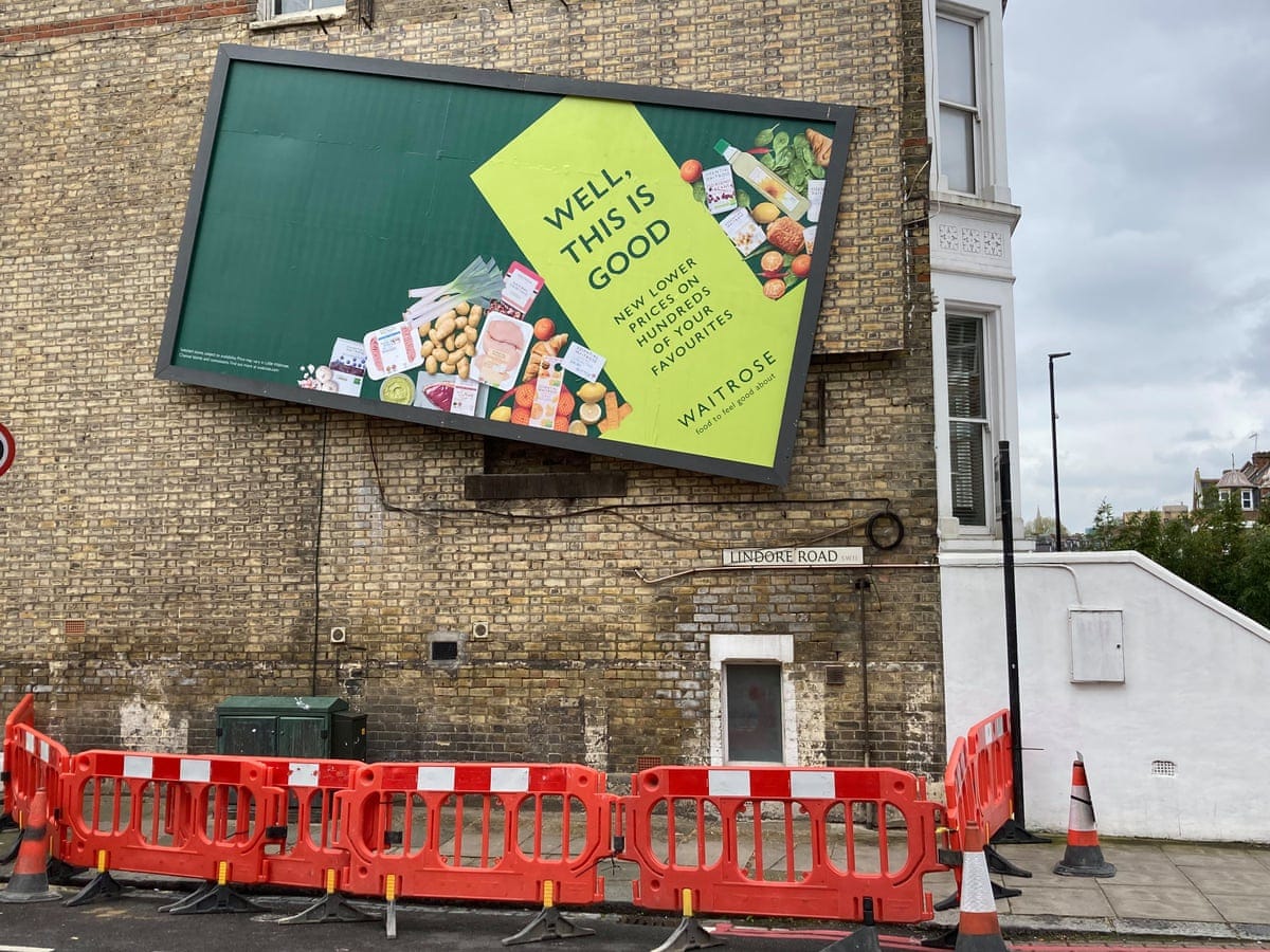 Wonky Waitrose billboard fenced off by London council as stunt backfires |  Waitrose | The Guardian