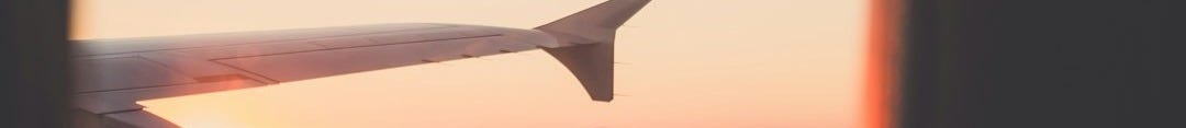 person riding airplane photography
