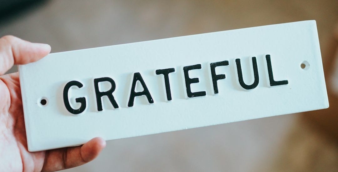 person holding white and black i am a good day card person holding white and black i am a good day card