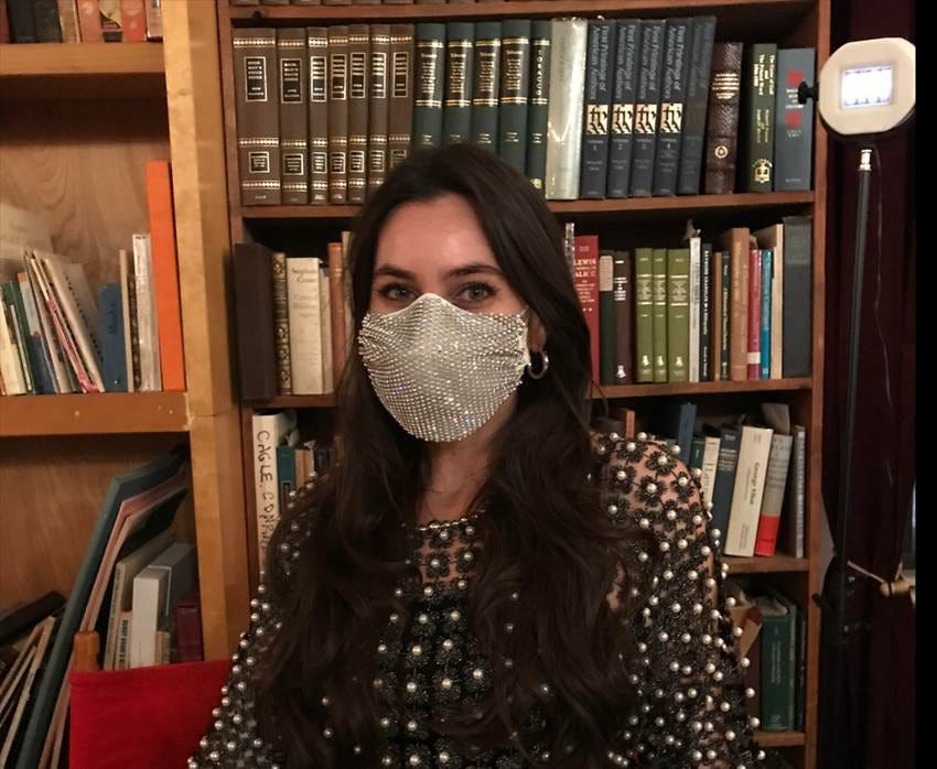 Lorenz wearing a silver sequin mask.