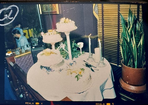 Analog photos of cakes at weddings by Angela Cappetta.