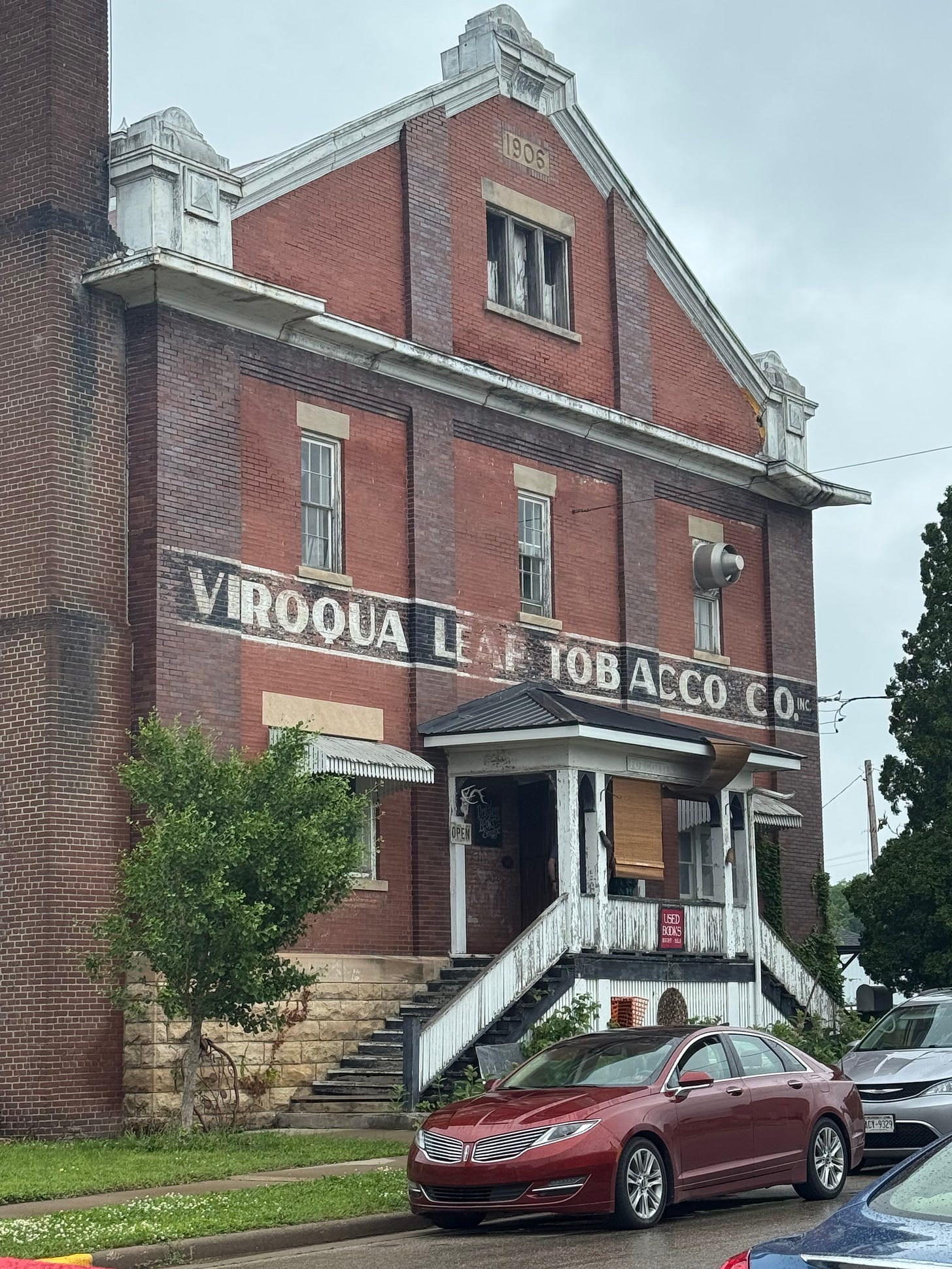 A three-story building with the words, “Viroqua Leaf Tobacco Co. Inc.” painted on the front.
