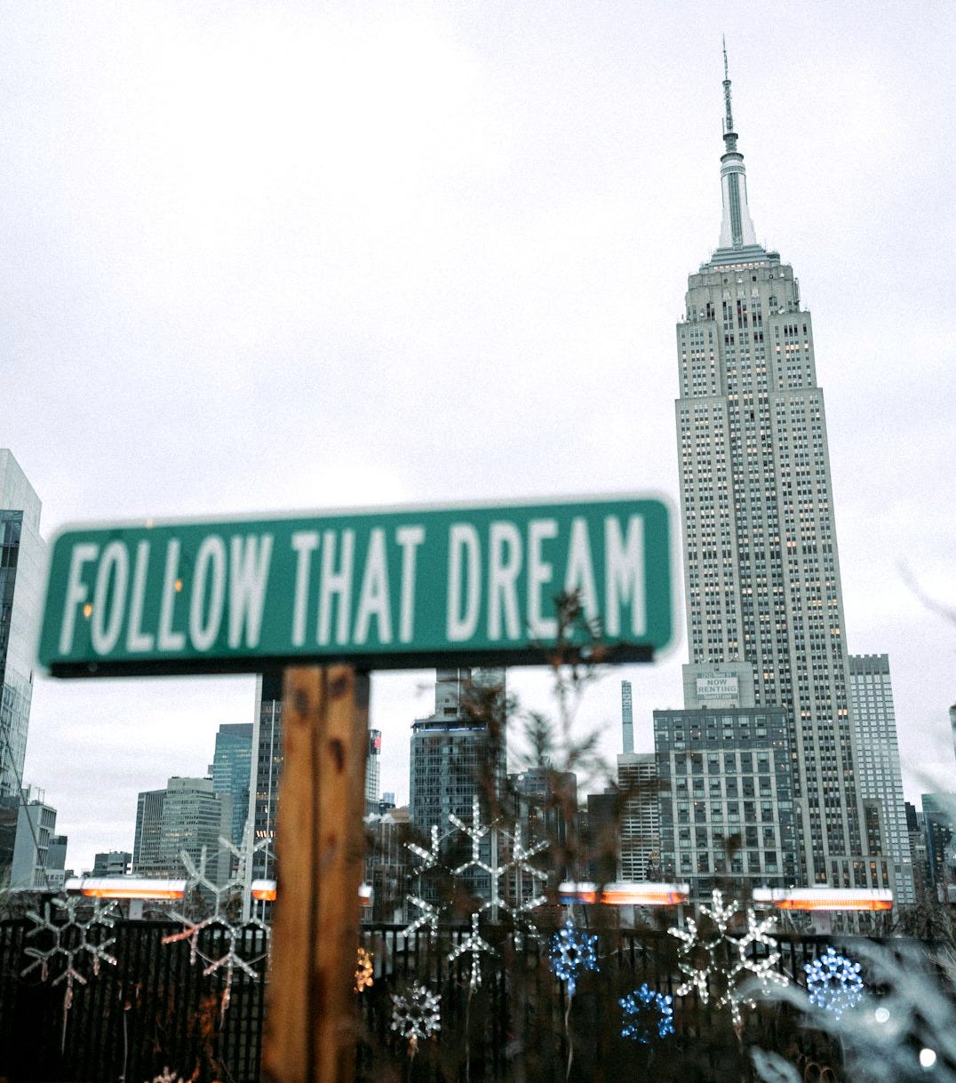 a street sign that reads follow that dream a street sign that reads follow that dream