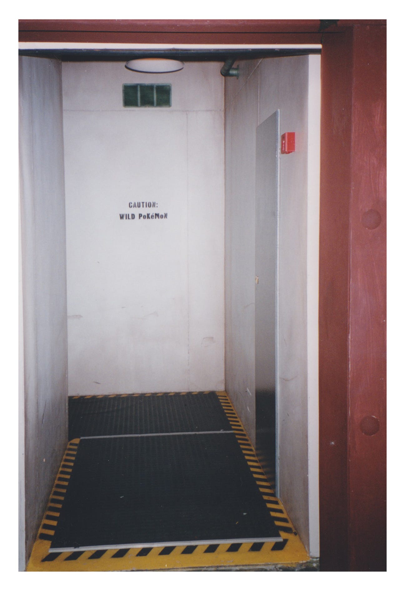 A doorway cautioning visitors about wild Pokémon