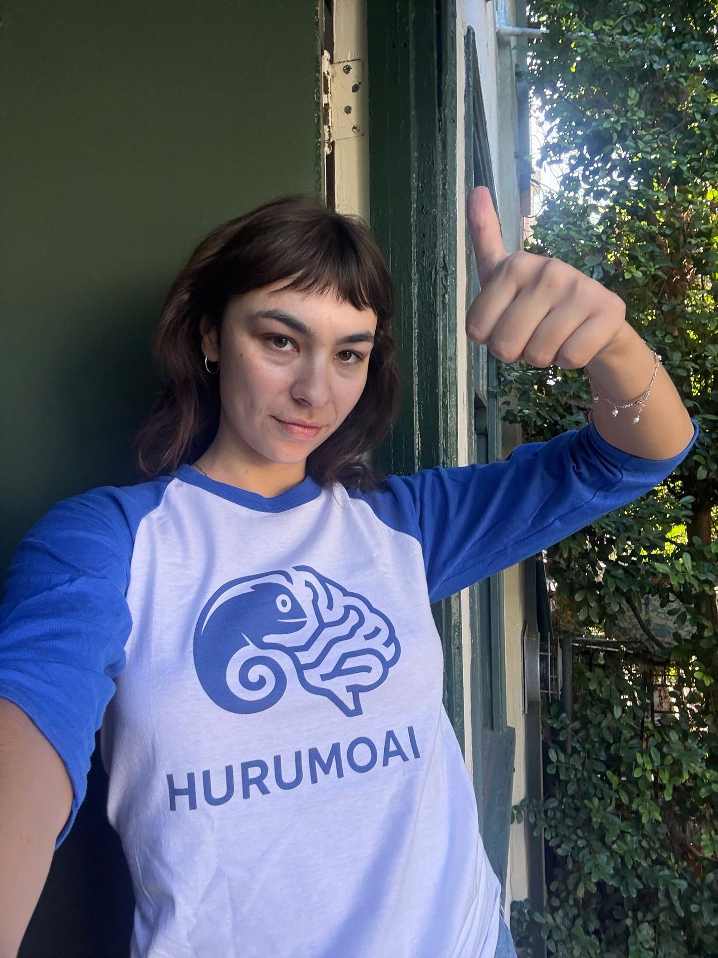 Sophie Bridges in a HurumoAI t-shirt