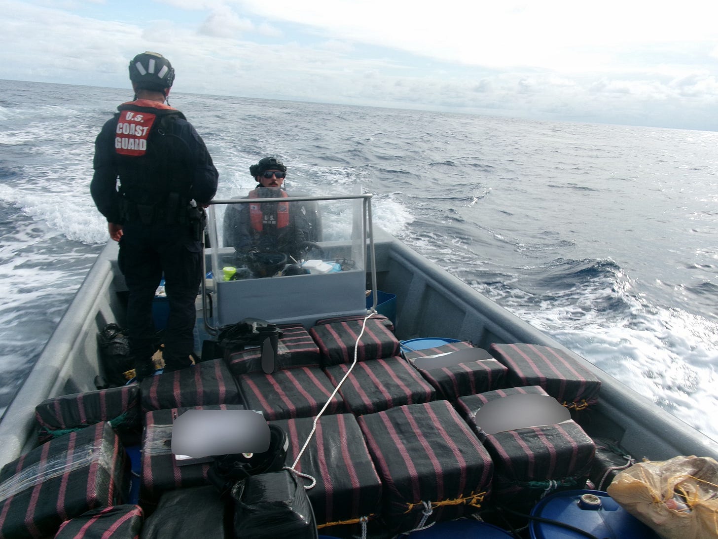 A Coast Guard Cutter Tampa boat crew transports seized narcotics to the cutter while underway off Costa Rica. Tampa’s crew and partner agencies seized 29,600 pounds of cocaine and 3,355 pounds of marijuana, worth an estimated $226.7 million, over the course of six interdictions. (U.S. Coast Guard photo).
