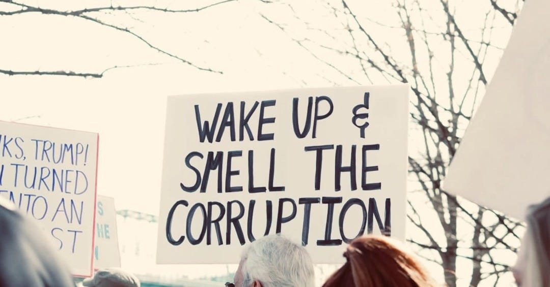 a group of people holding signs