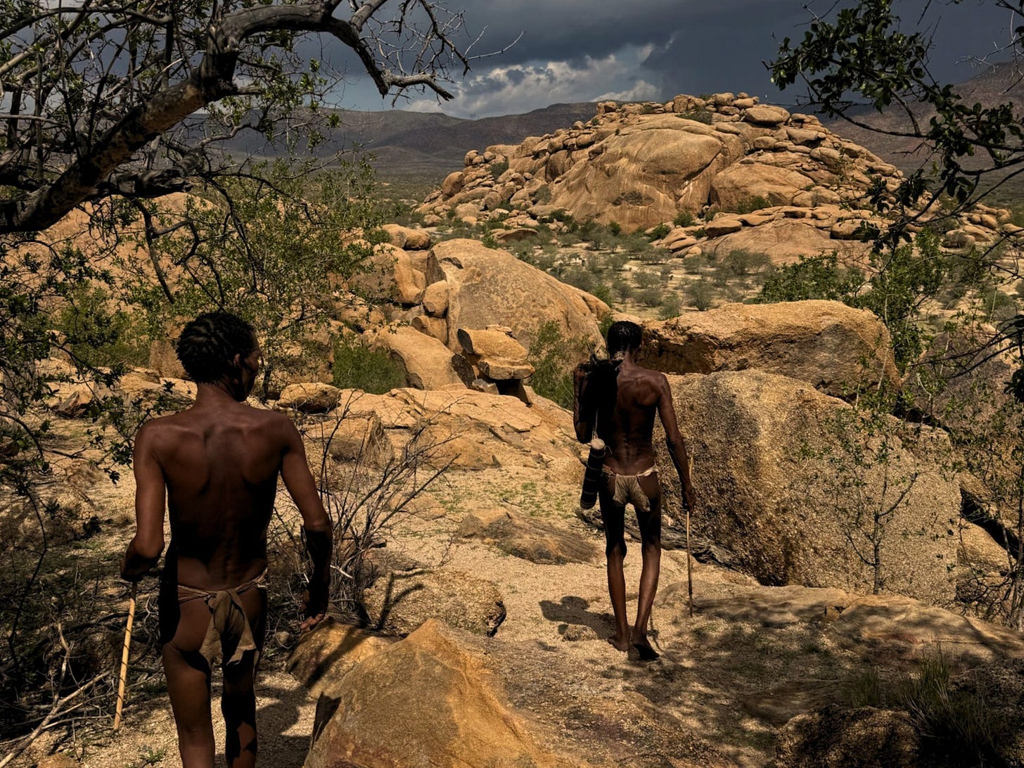 Kalahari landscape with San tribe hunting Kalahari landscape with San tribe hunting