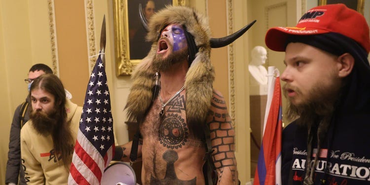 Q Shaman' pictured at riot, lawyer says he can only eat organic food -  Business Insider