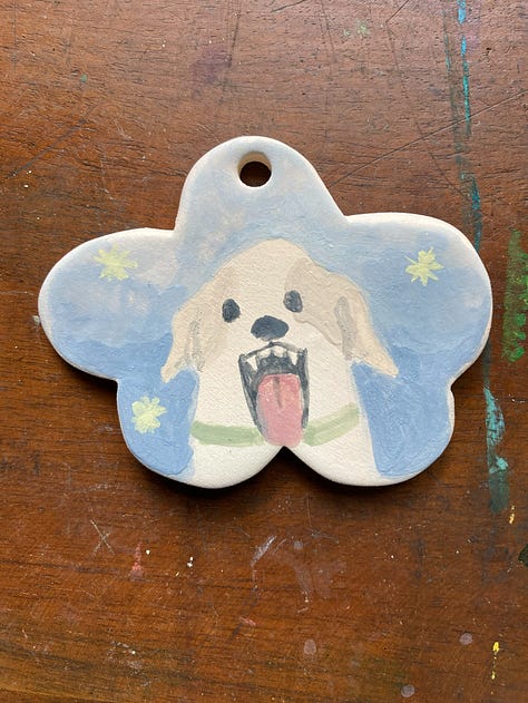 Three ornaments with dog portraits on them